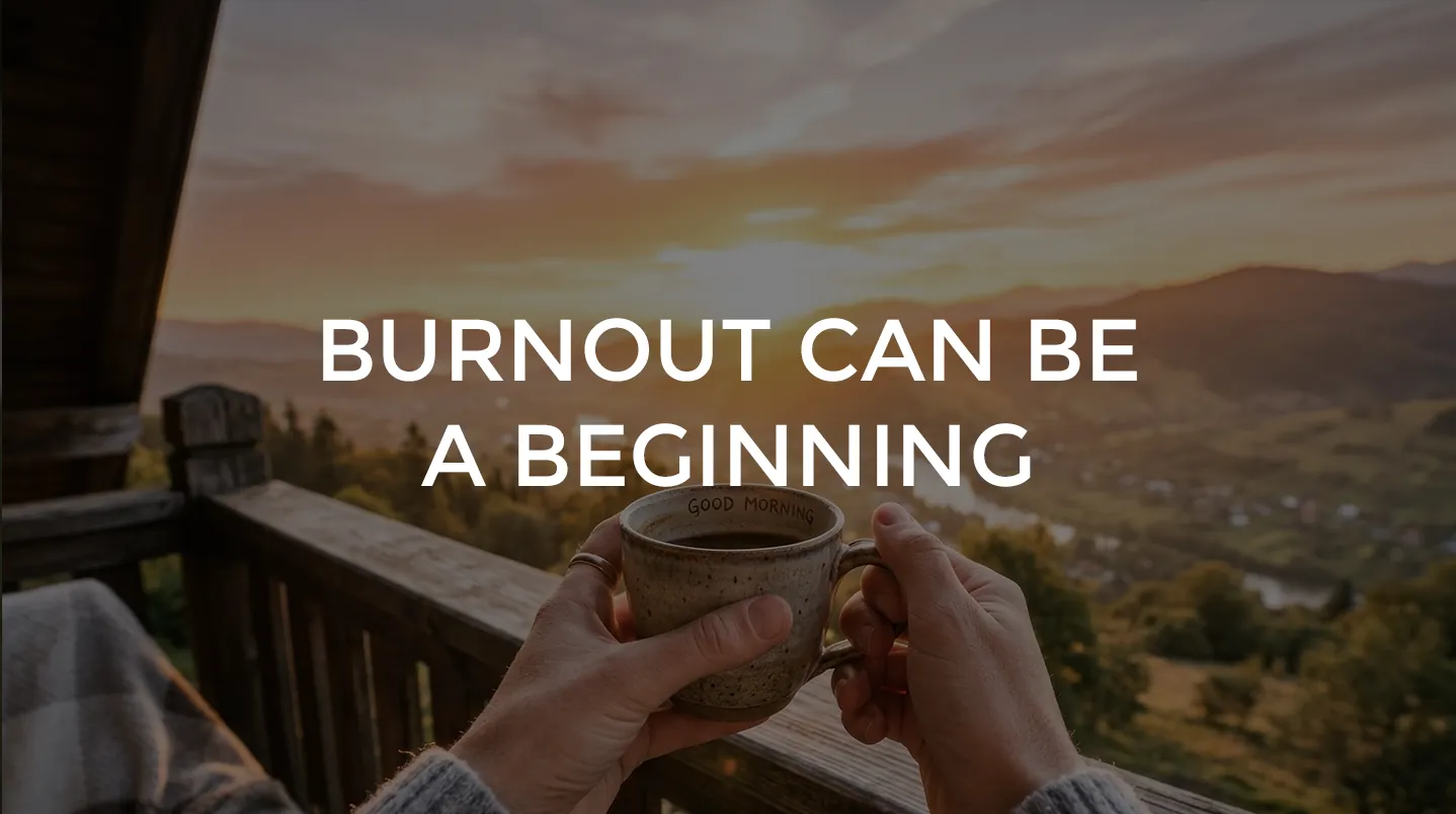 Hands holding a mug of coffee on a balcony at sunrise