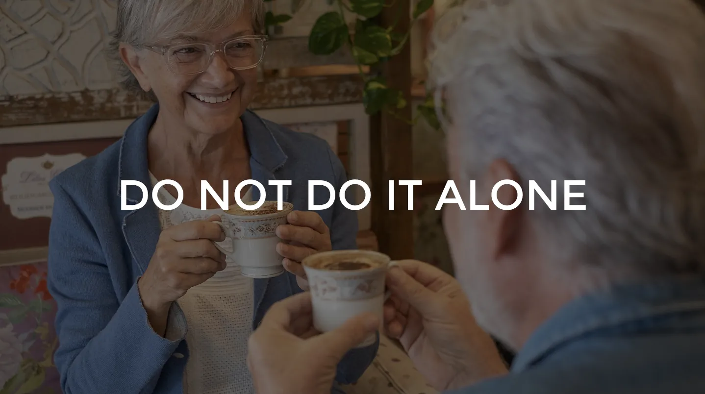 Two older friends sharing coffee